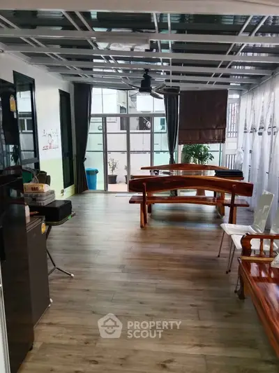 Spacious living room with wooden flooring and modern decor