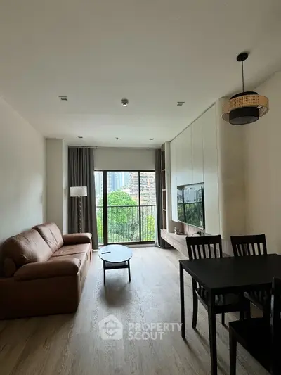 Modern living room with balcony view and stylish furniture