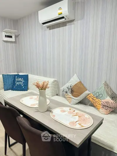 Chic dining area with cozy seating and stylish decor, perfect for intimate gatherings.