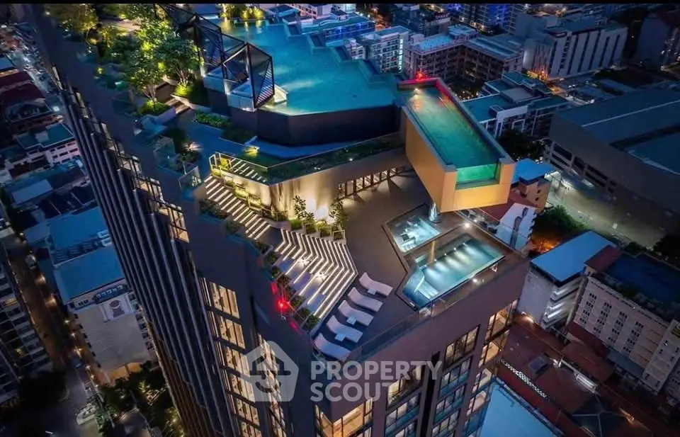 Stunning rooftop pool and terrace with cityscape views in luxury high-rise building.