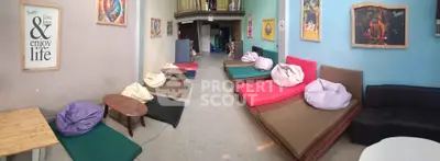 Cozy common area with colorful bean bags and inspirational wall art