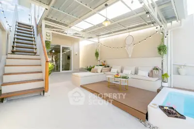 Chic outdoor patio with cozy seating and modern decor, perfect for relaxation and entertaining.
