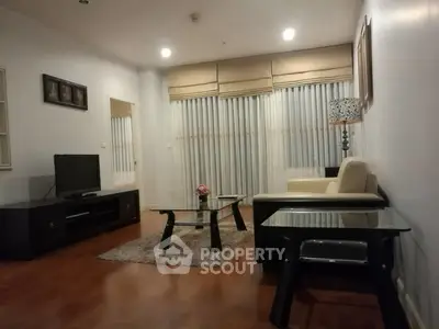 Spacious living room with modern furniture and large windows for natural light.