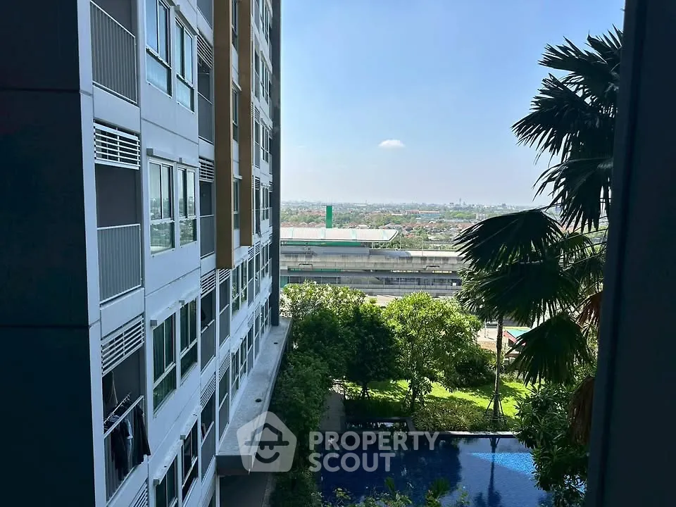 Stunning high-rise apartment with pool and city view, perfect for urban living.