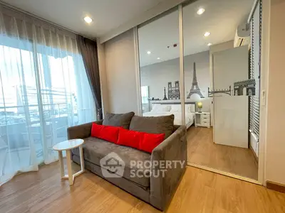 Modern living room with glass partition and stylish decor