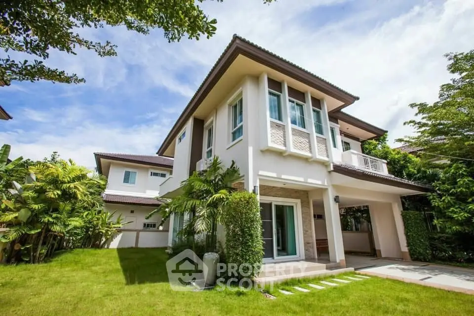 Stunning two-story modern house with lush garden and spacious driveway, perfect for family living.