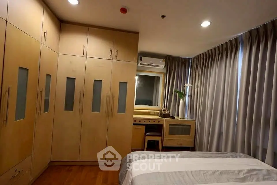 Cozy bedroom with built-in wardrobe and modern decor