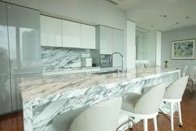 Luxurious modern kitchen with marble island and sleek cabinetry