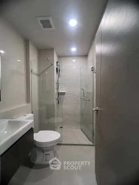 Modern bathroom with sleek design and glass shower enclosure