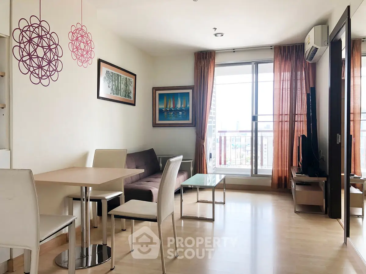 Bright and modern living room with stylish decor and large window view.