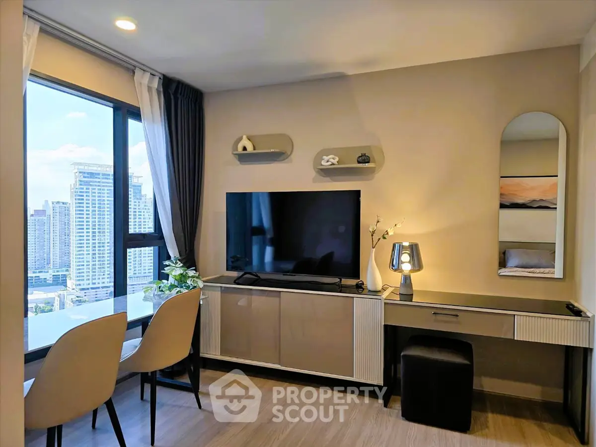 Modern living room with city view, stylish decor, and sleek furniture