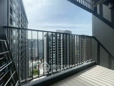 Modern balcony with city view in high-rise building, perfect for urban living.