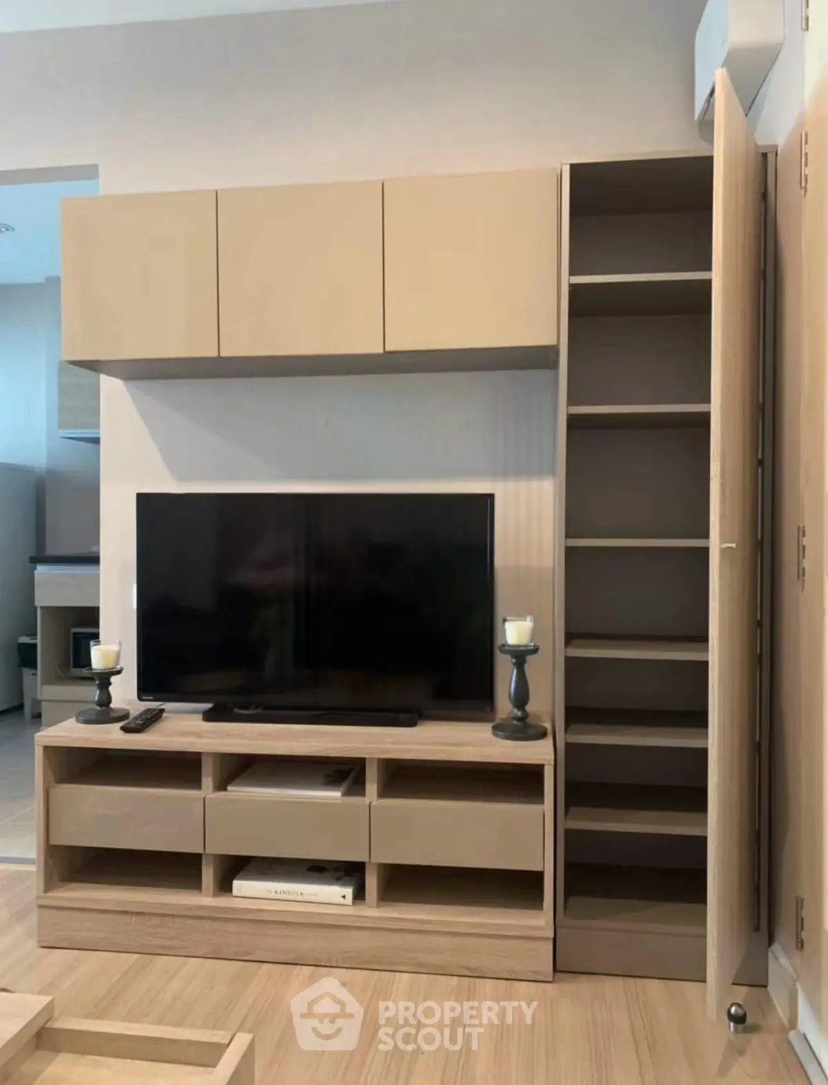 Modern living room with sleek TV unit and ample storage space
