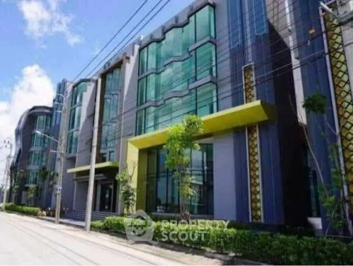 Modern architectural building with glass facade and unique design elements