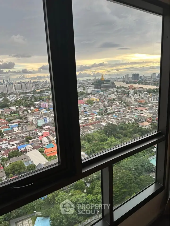 Stunning high-rise cityscape view from a modern apartment window, showcasing vibrant urban living.