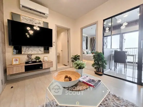 Modern living room with stylish decor and open layout leading to dining area.