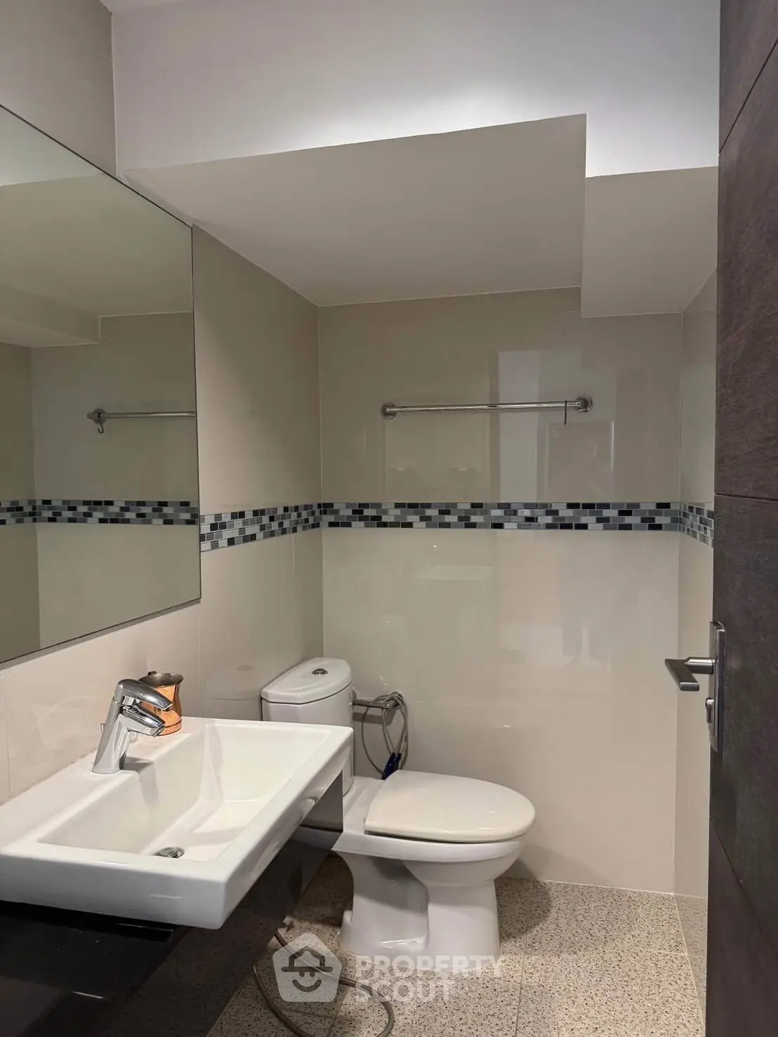 Modern bathroom with sleek fixtures and stylish tile accents.