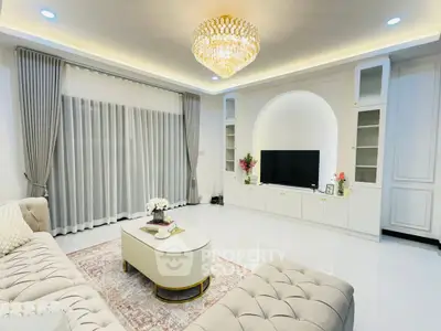 Luxurious living room with elegant chandelier and modern decor