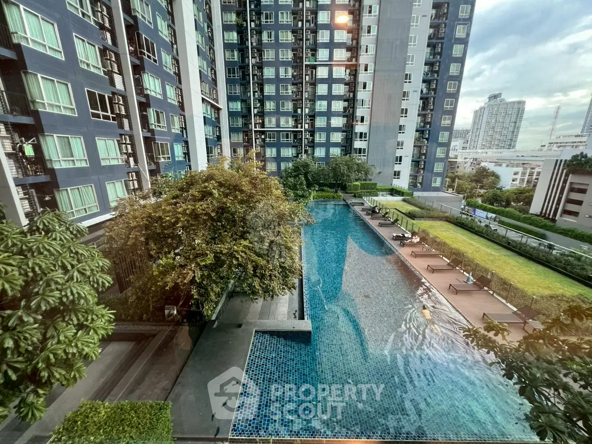 Modern condominium with pool and lush garden view in urban setting