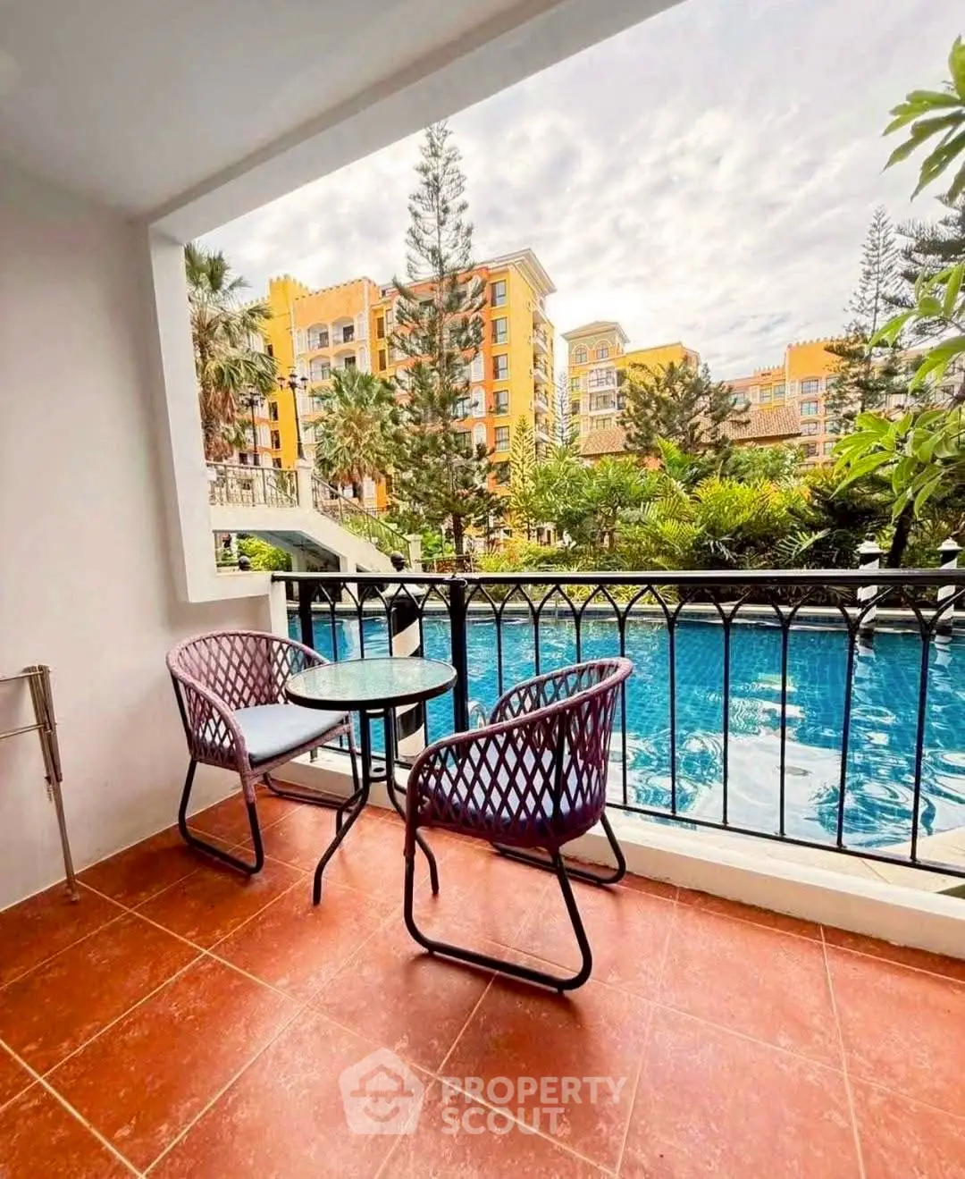 Charming balcony with pool view in vibrant residential complex