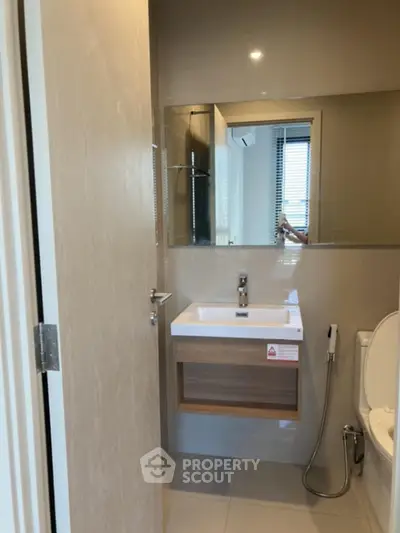 Modern bathroom with sleek sink and mirror design