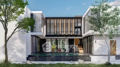 Modern luxury home with sleek design and private pool, surrounded by lush greenery.