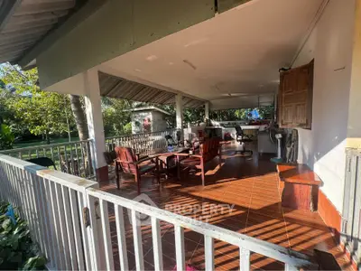 Spacious outdoor patio with seating and garden view, perfect for relaxation.