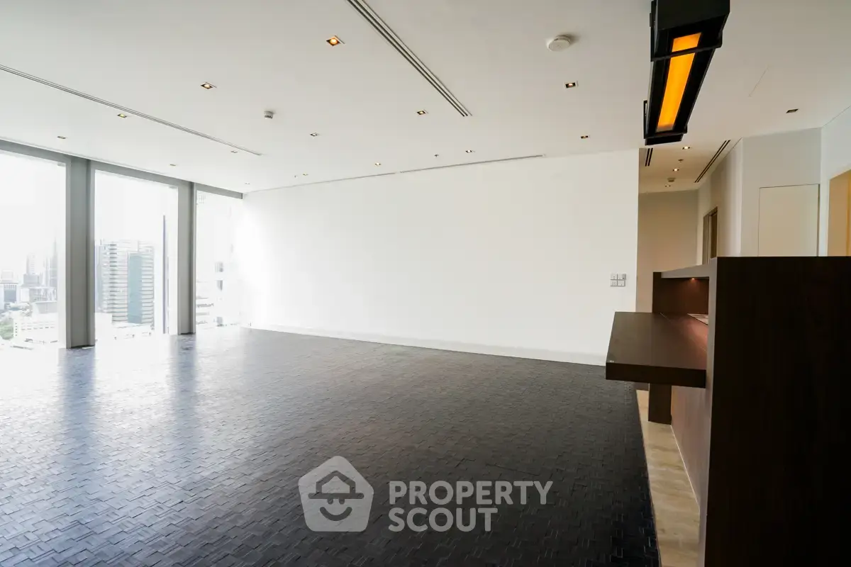 Spacious modern living room with city view and sleek design