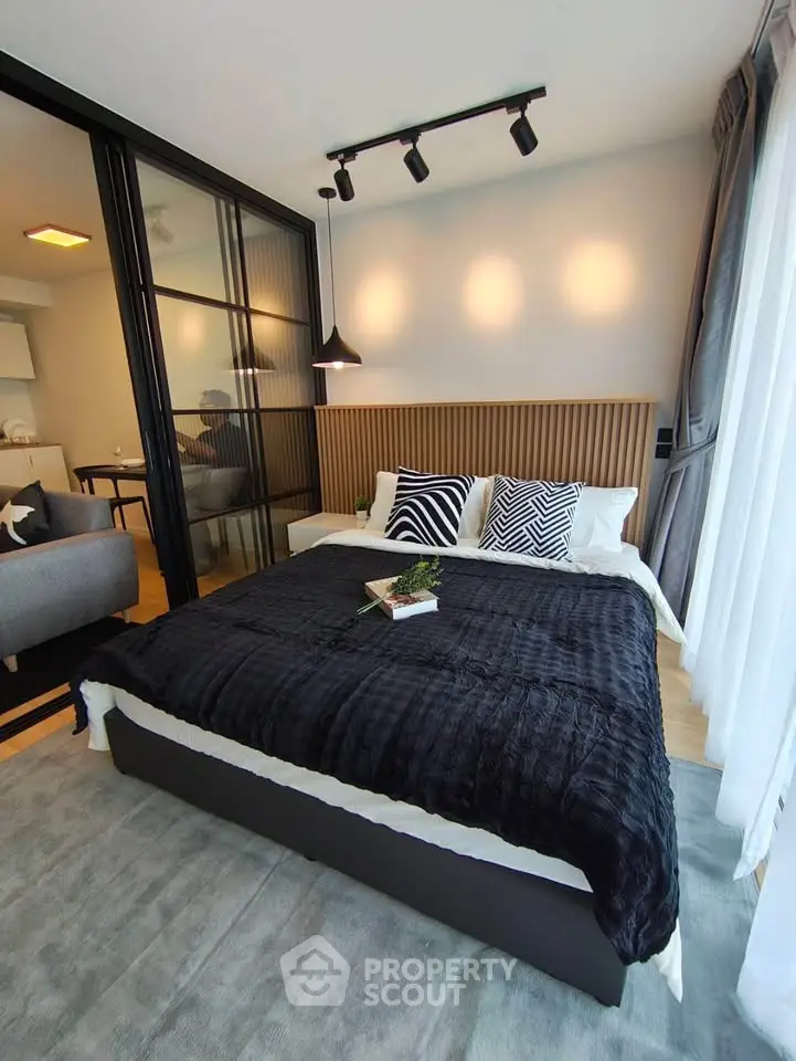 Modern bedroom with stylish decor and cozy ambiance in a contemporary apartment.