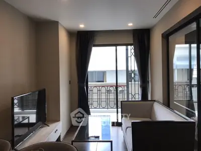 Modern living room with balcony view and sleek furniture