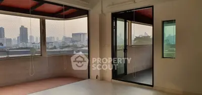 Spacious corner unit with panoramic city views and large balcony, perfect for urban living.