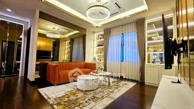 Luxurious living room with elegant chandelier and modern decor