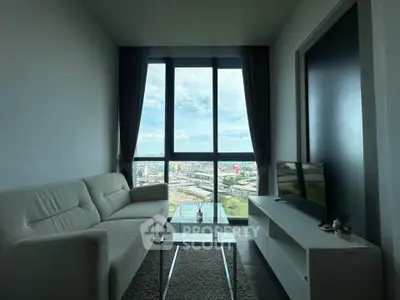 Modern living room with large window offering stunning city view, featuring sleek furniture and minimalist decor.