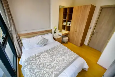 Modern bedroom with stylish decor and ample natural light