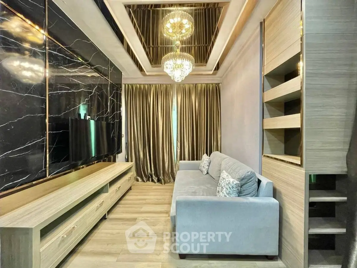 Luxurious living room with elegant chandelier and modern decor