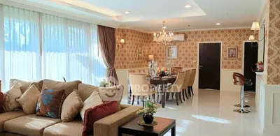 Luxurious living and dining area with elegant decor and ample natural light