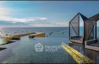 Luxurious rooftop infinity pool with stunning ocean view and modern cabanas, perfect for relaxation and leisure.
