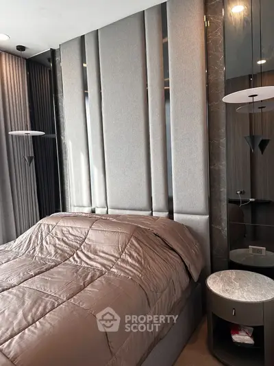 Luxurious modern bedroom with elegant decor and plush bedding in a high-end apartment.
