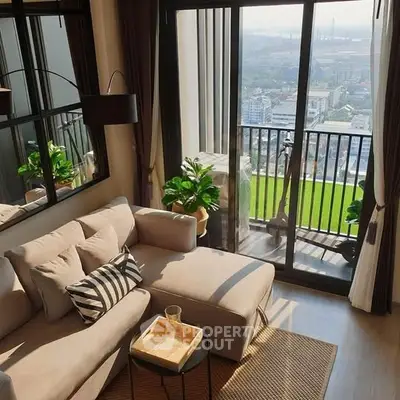 Chic living room with cozy sofa and stunning city view from balcony