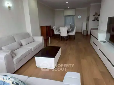 Spacious living room with modern furniture and wooden flooring