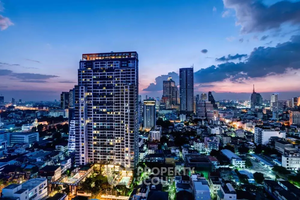Stunning cityscape view with illuminated skyscrapers at dusk, showcasing urban living.