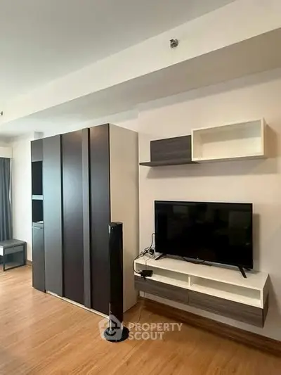 Modern living room with sleek TV setup and stylish storage solutions