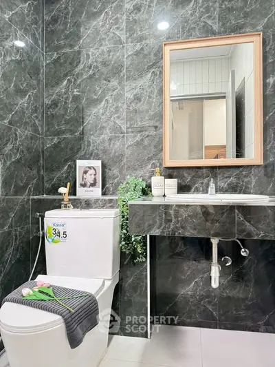 Modern bathroom with sleek marble tiles and elegant fixtures