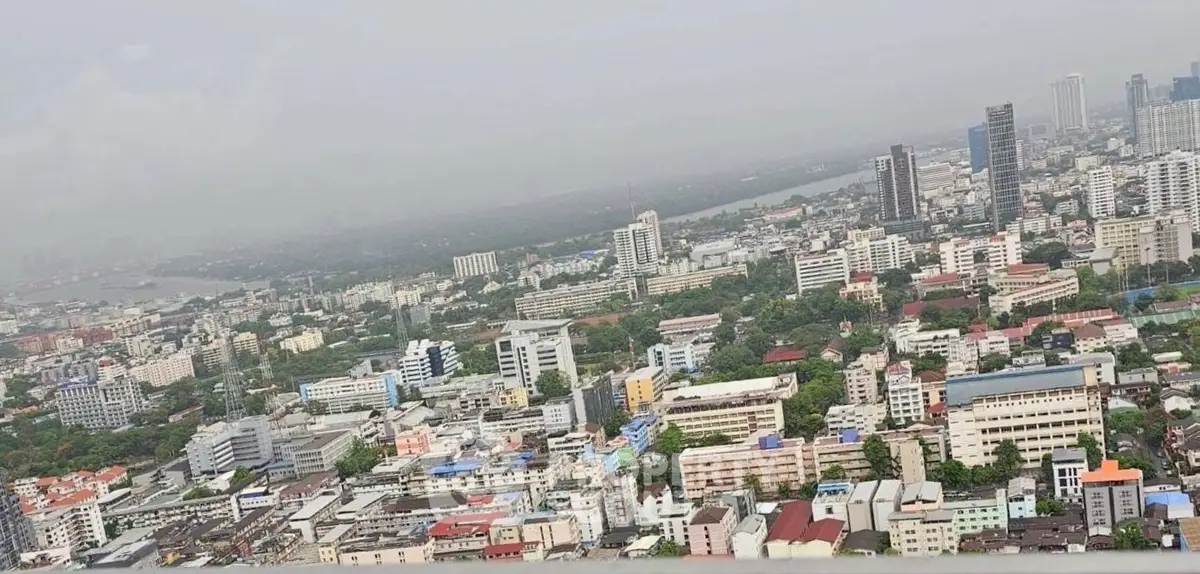 Stunning aerial view of a bustling cityscape with diverse architecture and lush greenery.