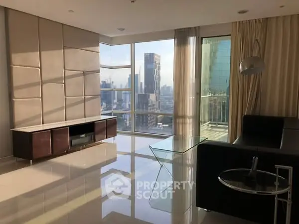 Luxurious corner unit living room with stunning city view and modern furnishings.