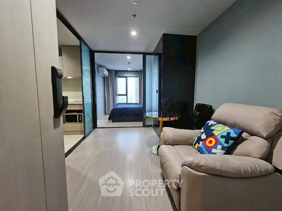 Modern studio apartment with cozy living area and stylish bedroom