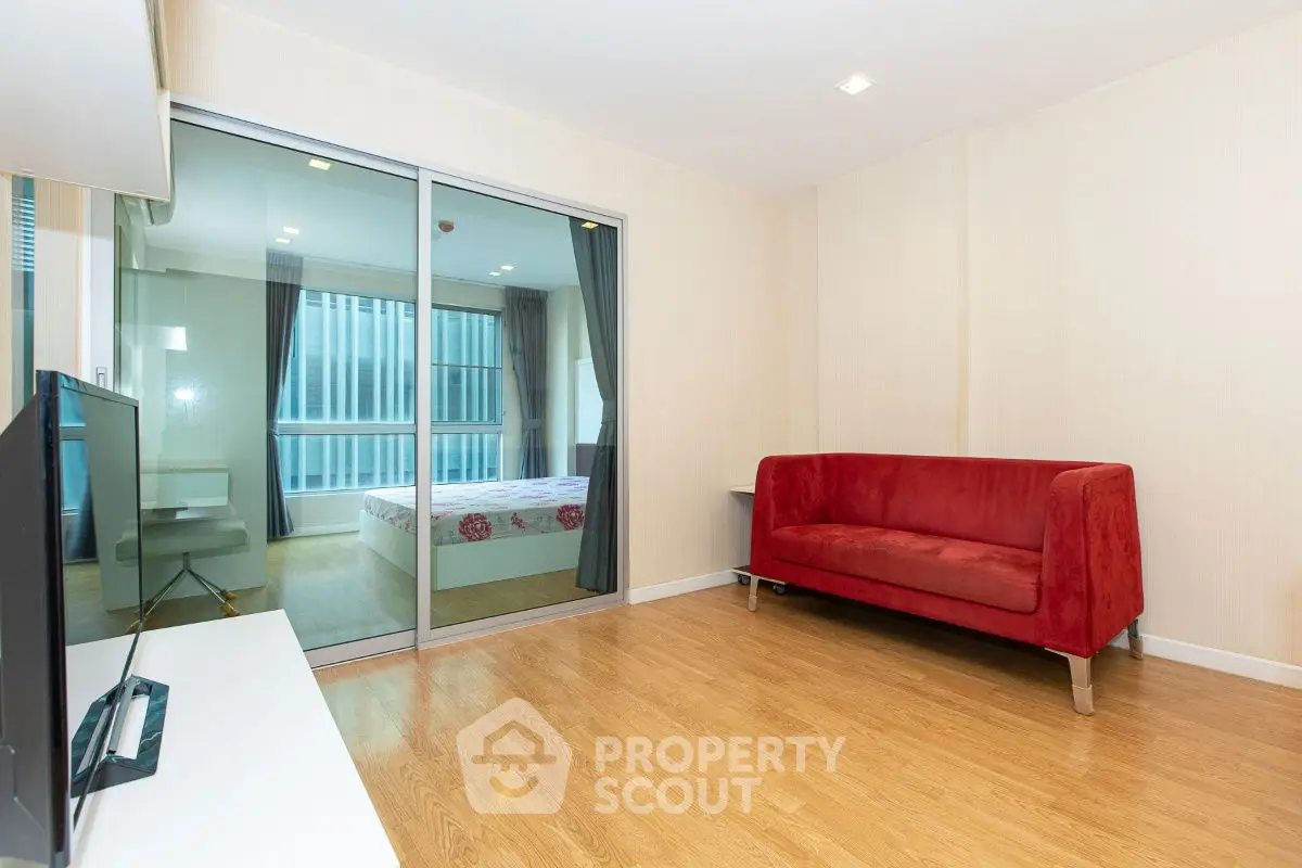 Modern apartment with cozy living room and bedroom view