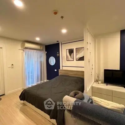 Modern bedroom with stylish decor and cozy ambiance, featuring a comfortable bed and elegant furnishings.