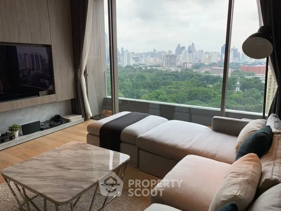 Luxurious living room with panoramic city view and elegant furnishings.