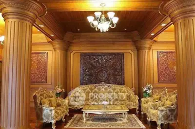 Luxurious living room with ornate wooden decor and elegant furniture